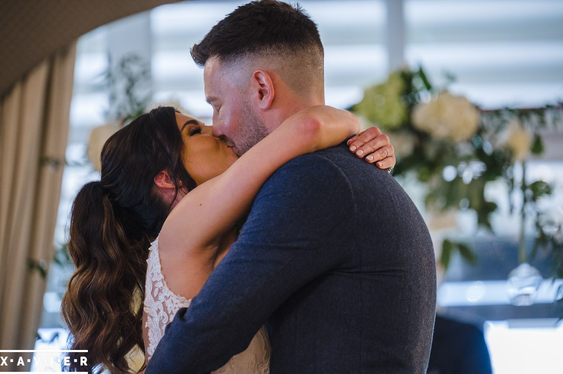 bride and groom kiss during the ceremony