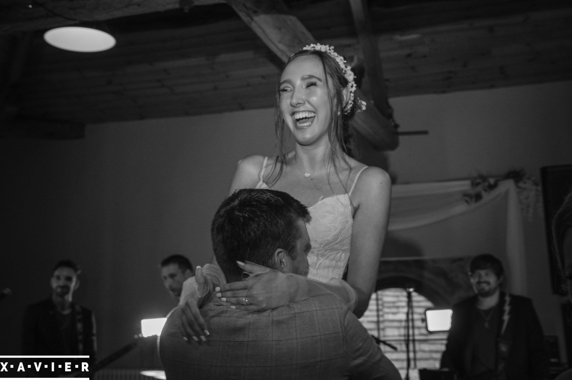 groom lifts the bride during the first dance