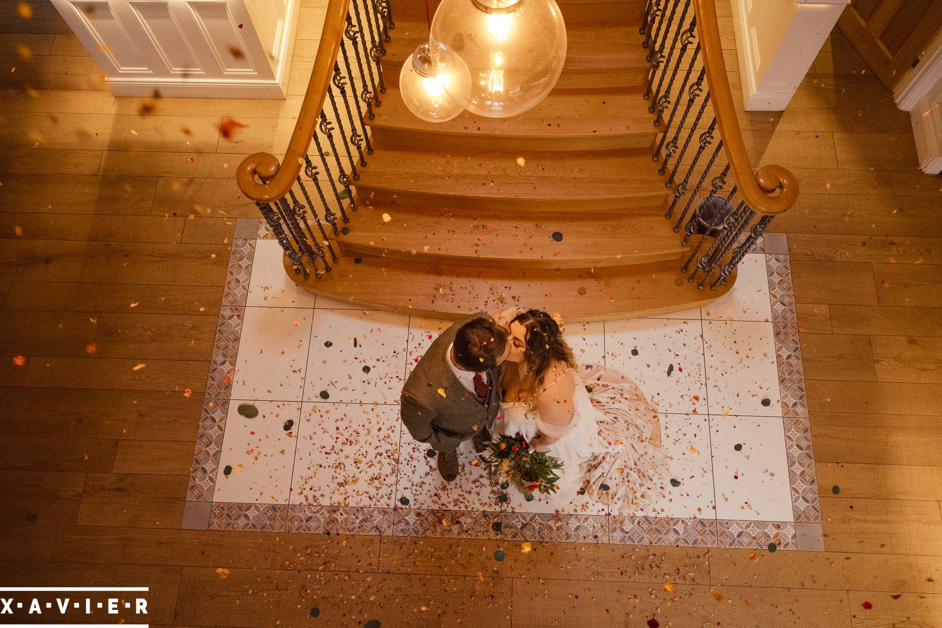 Confetti falls on the couple standing below