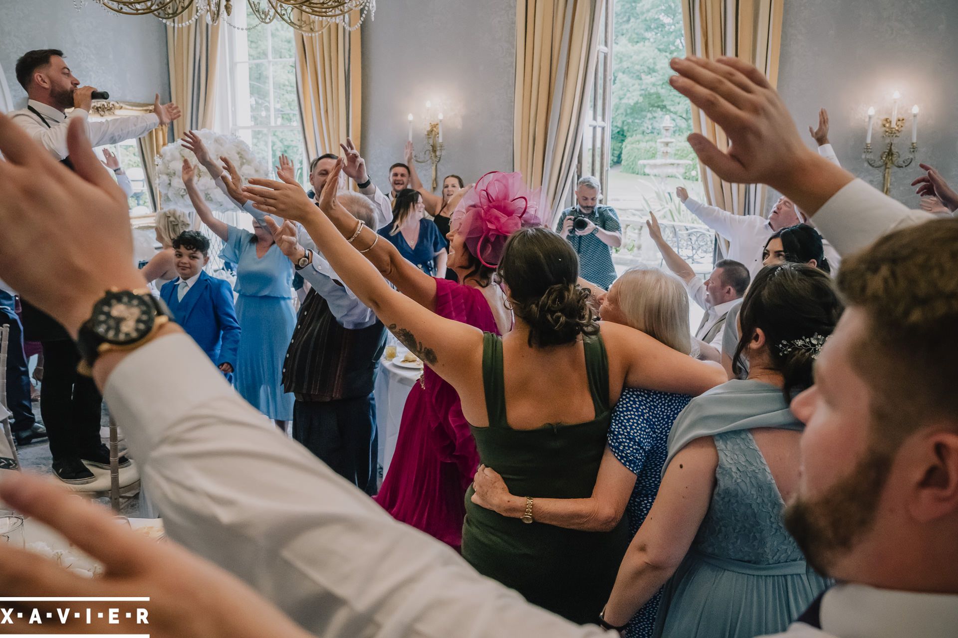 guests dancing to singing waiters