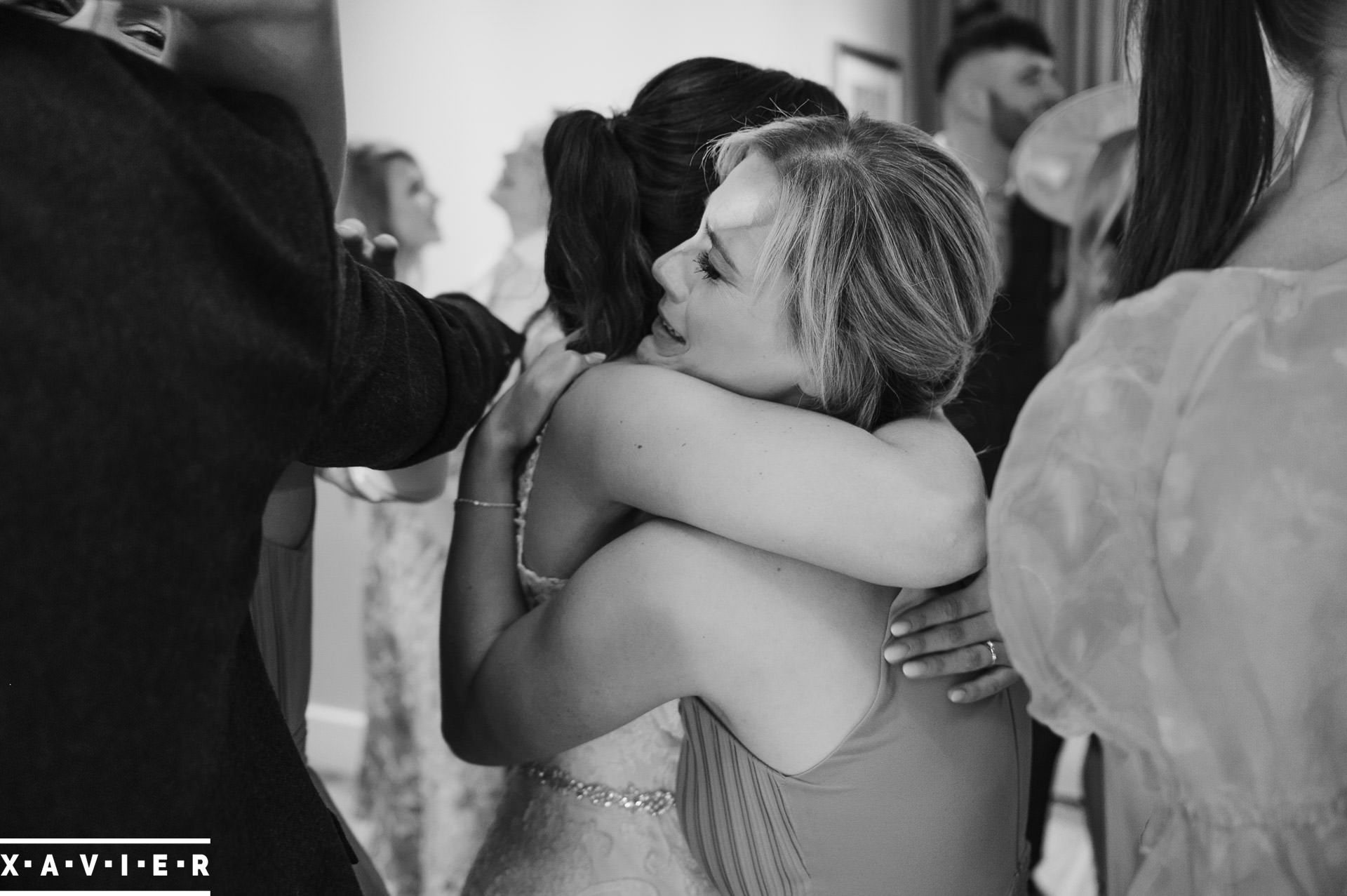 Bride hugs the bridesmaid