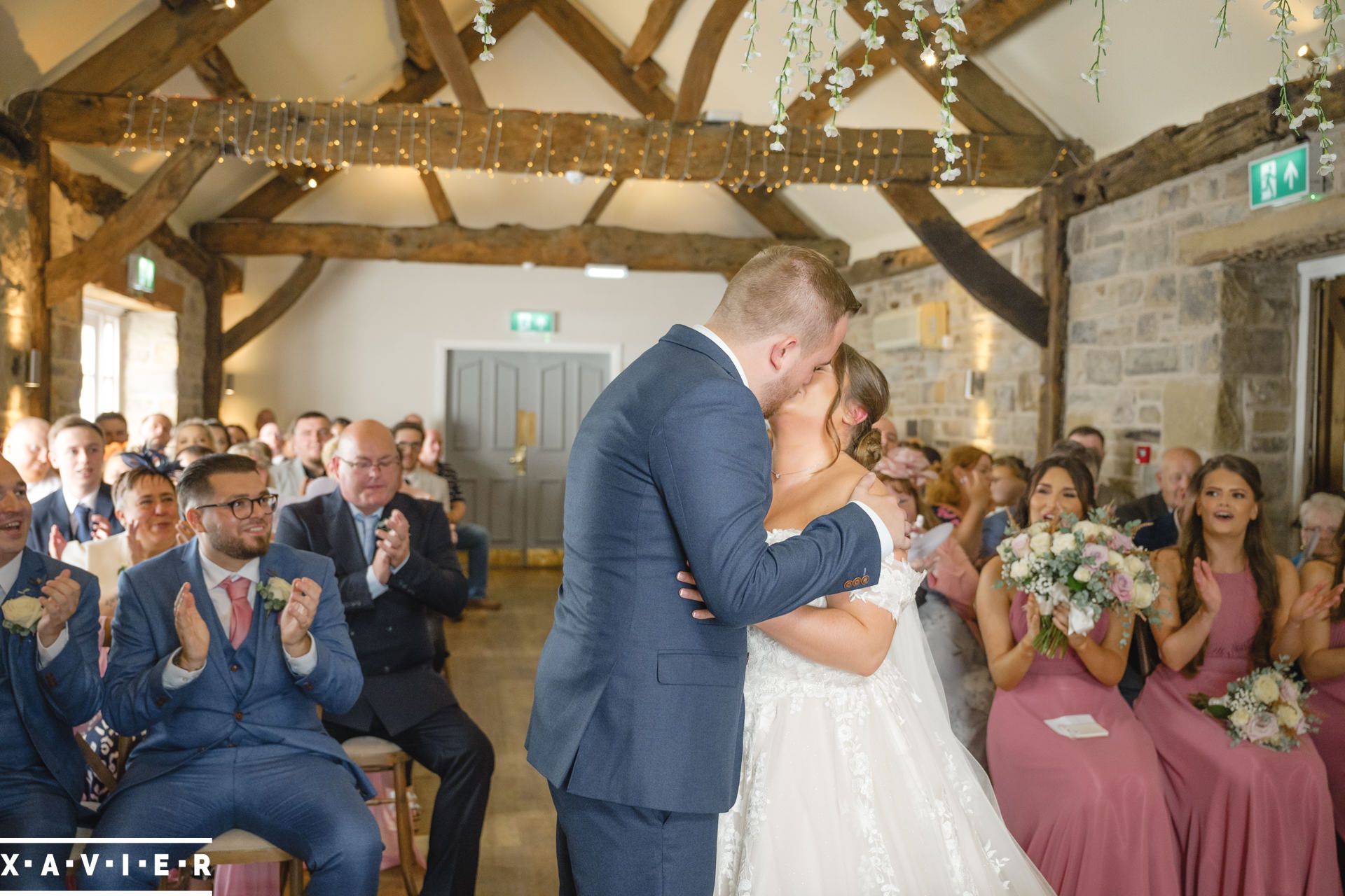 bride and groom kiss during the ceremony