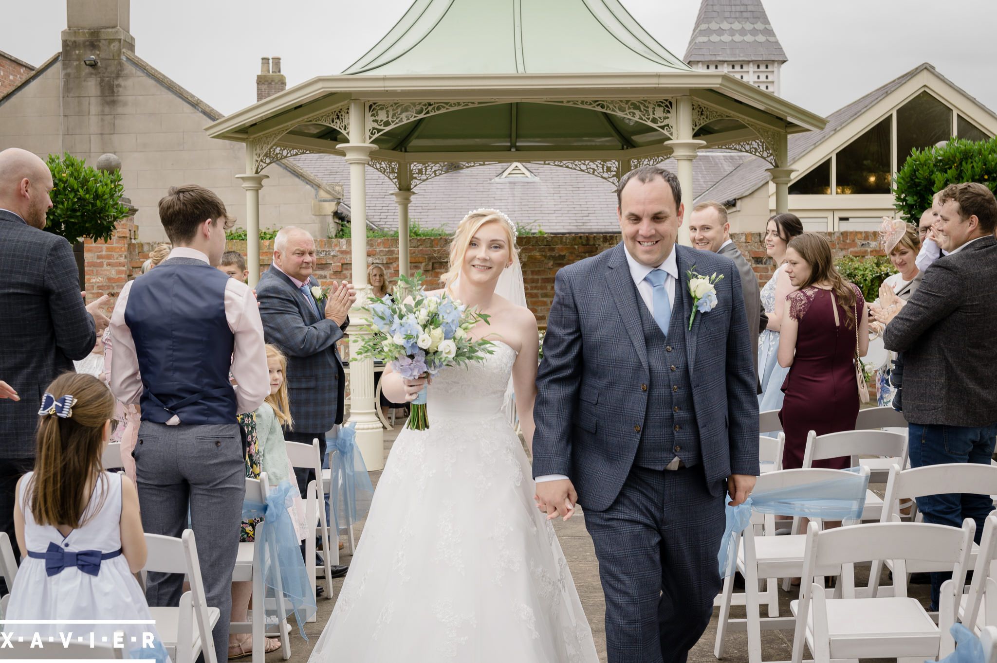 bride and groom walking down the aisle