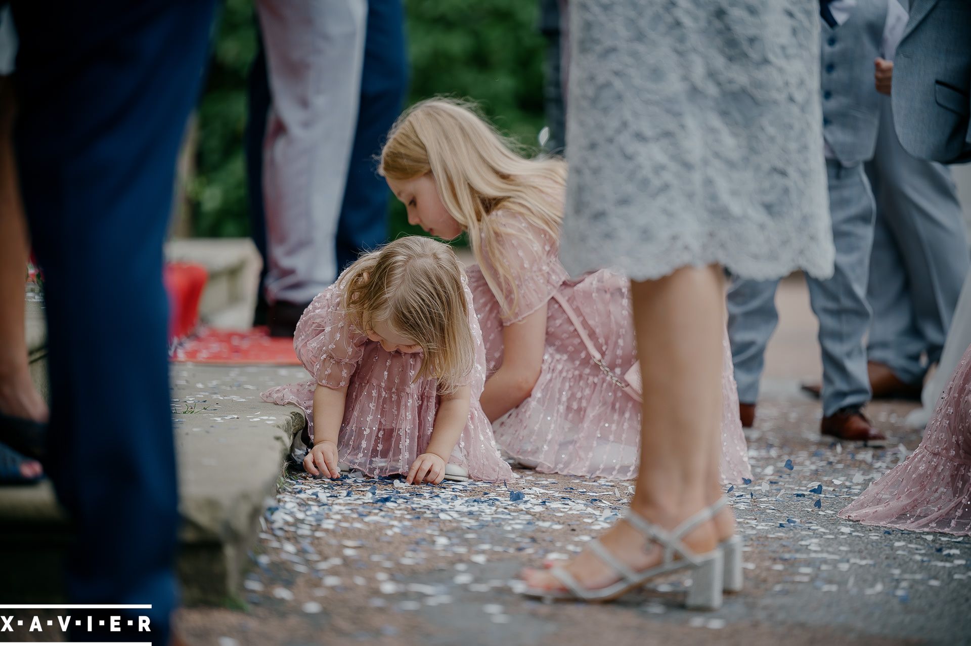 young children gathering confetti