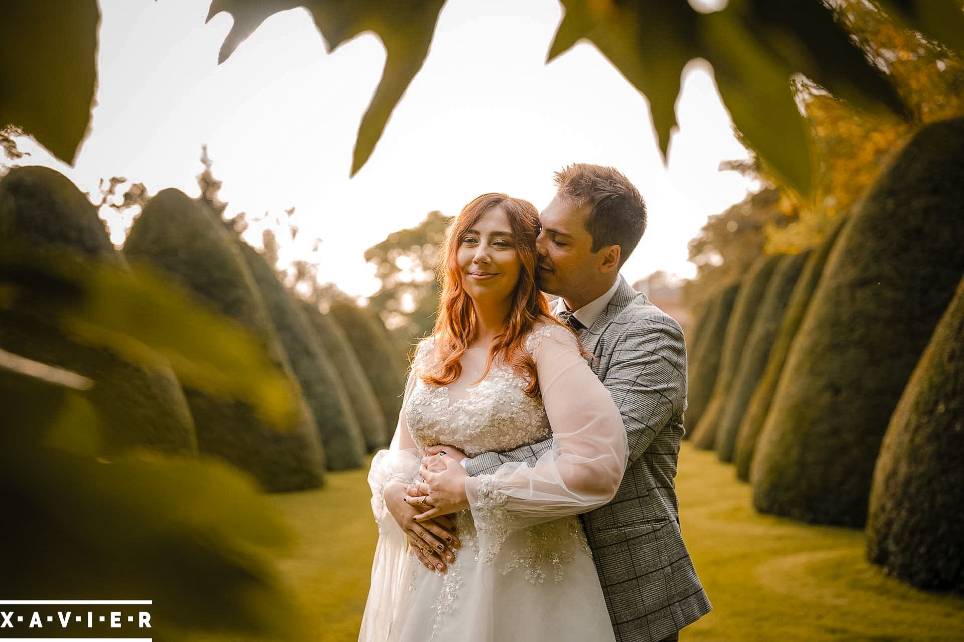 The groom whispers into the brides ear