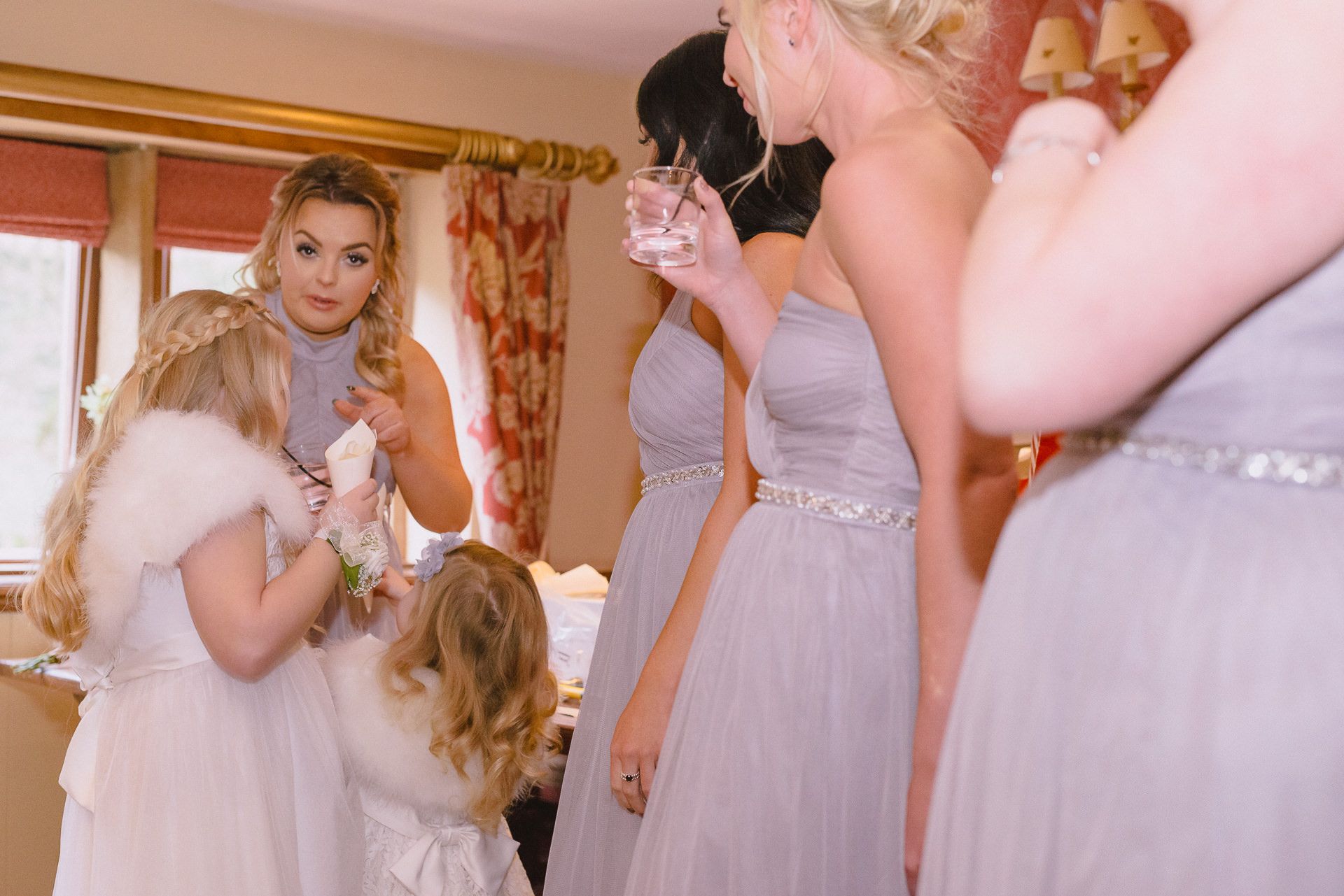 the flower girls receive their confetti ready for the reception