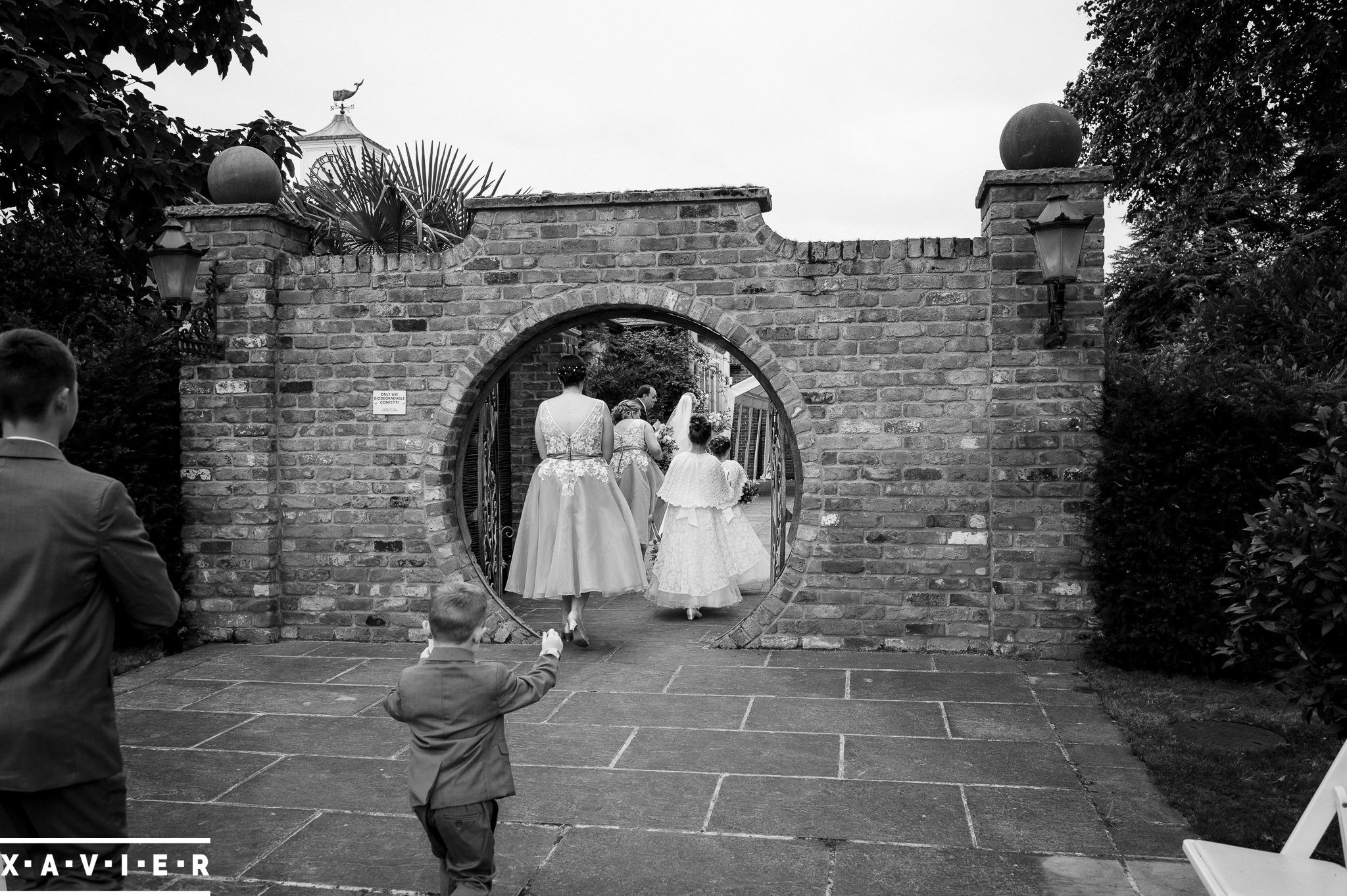 page boy follows the bridal party