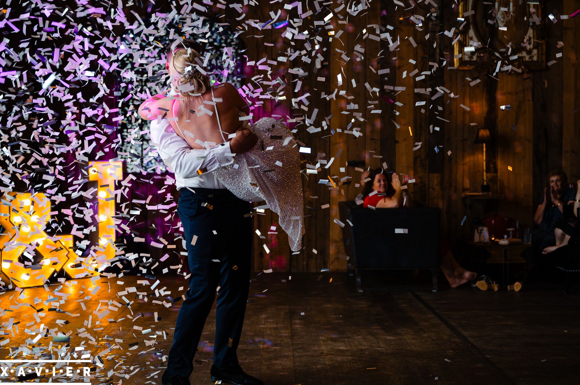 groom carries the bride