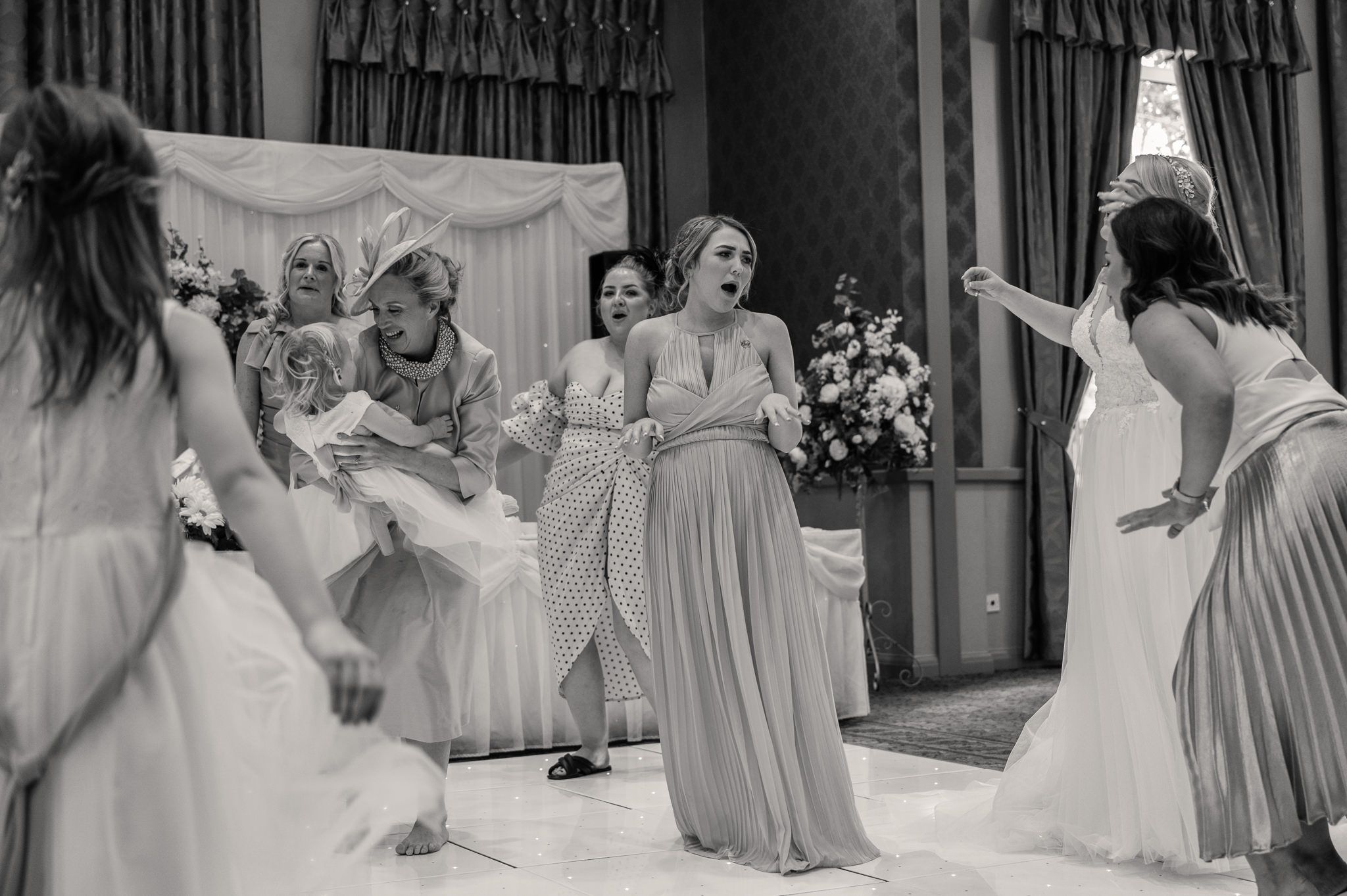 Bride dancing with bridesmaids