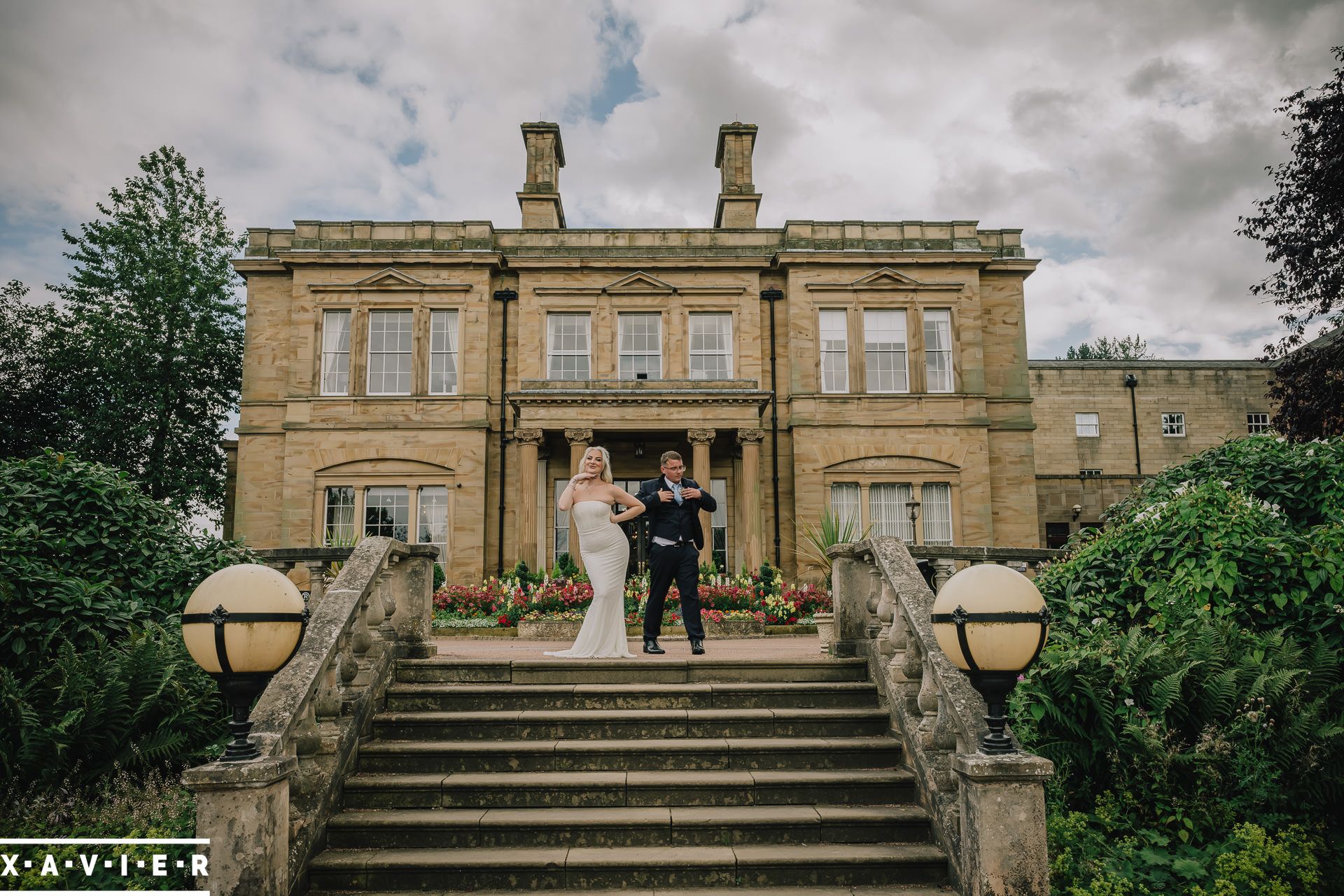 bride and groom at the front of oulton hall