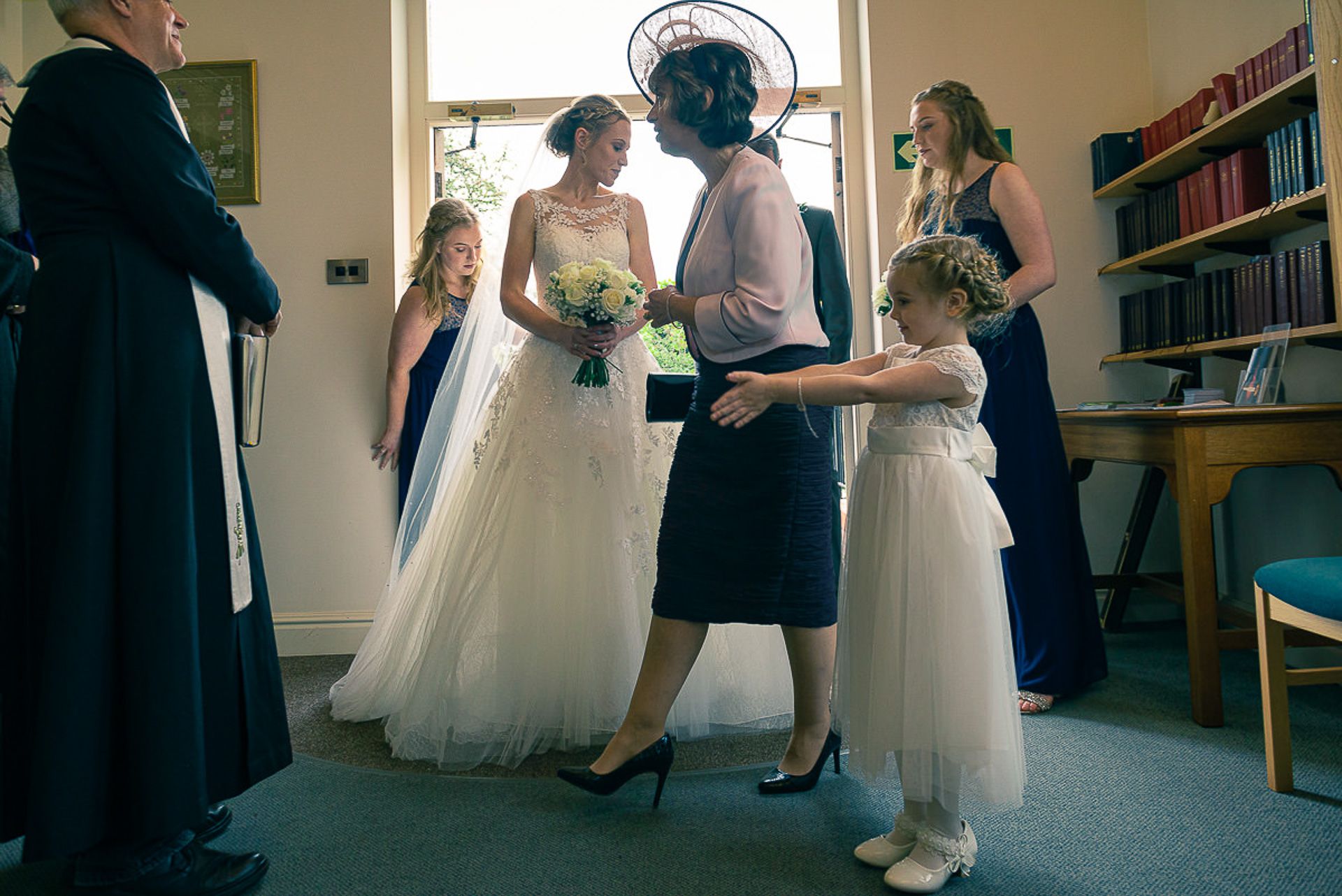 bride and bridesmaids wait to enter the church
