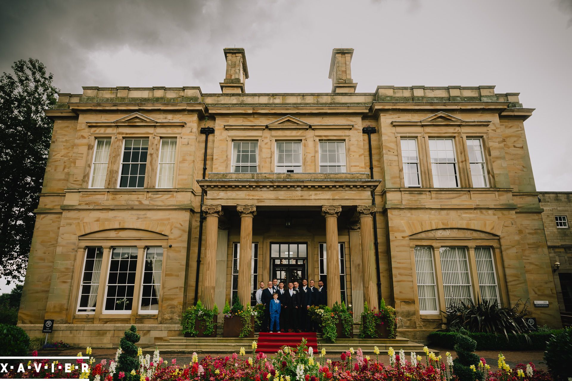 groomsmen standing at the front door