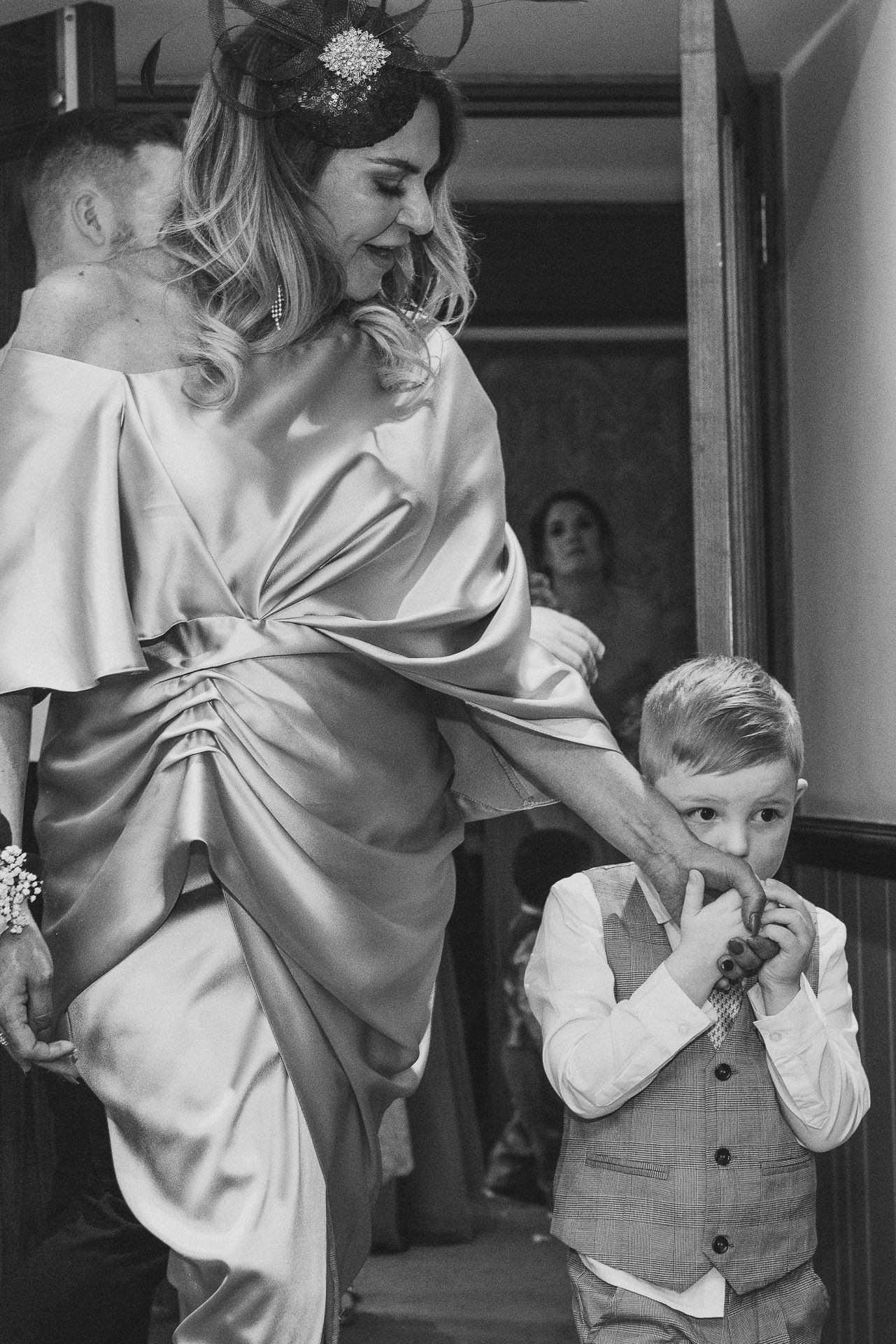 close up image of pageboy looking nervous before walking down the aisle with bridesmaid