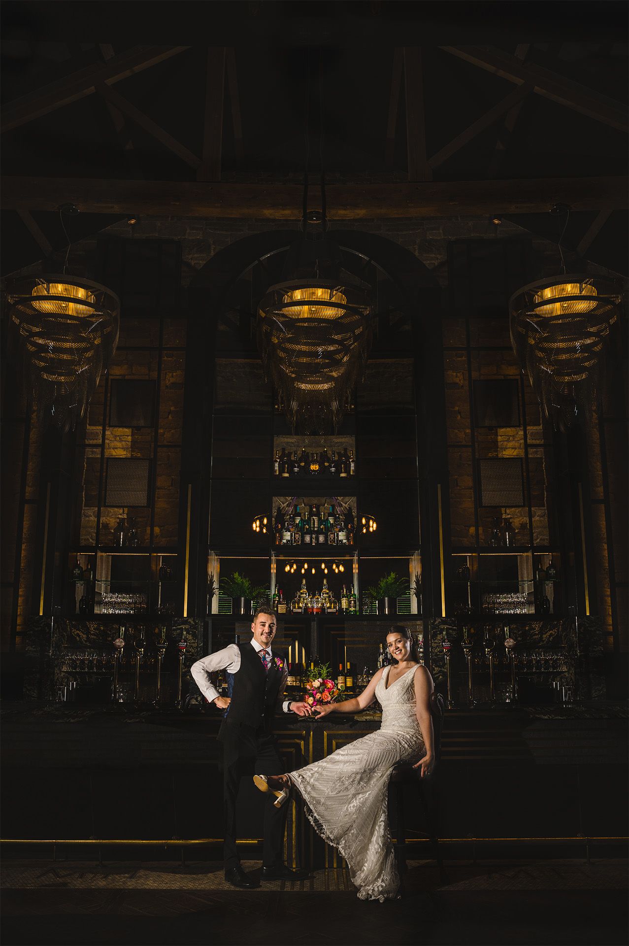 bride and groom at the coach house bar