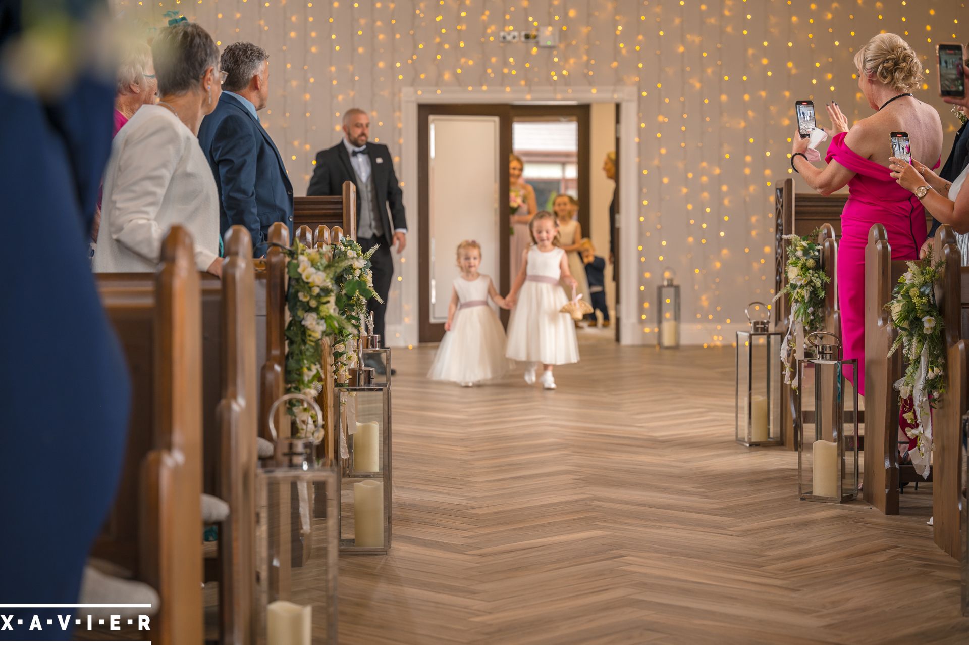 flowergirls are walking down the aisle