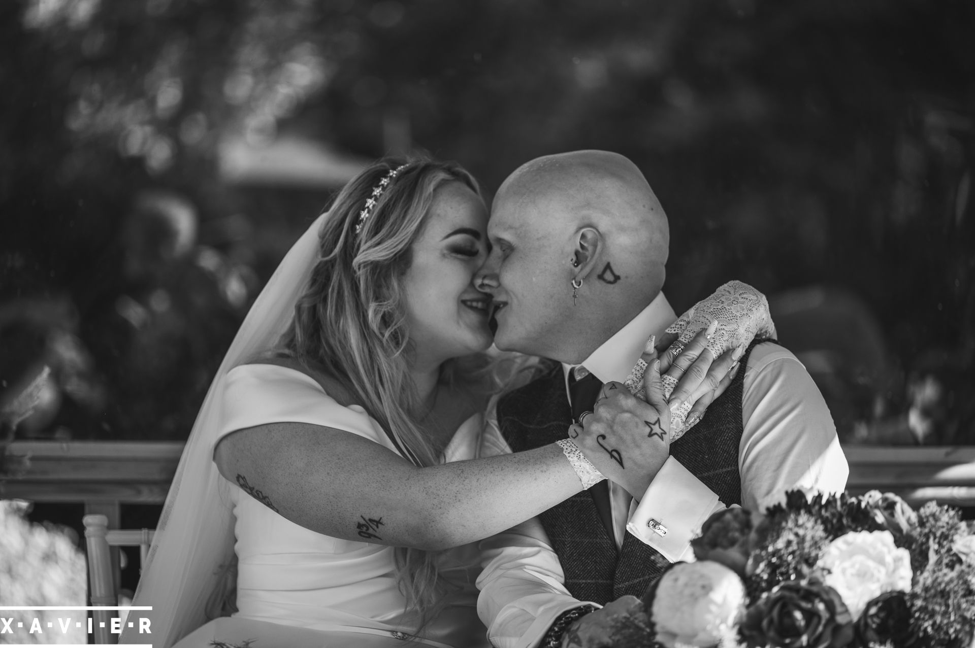 bride and groom wrap their arms around each other