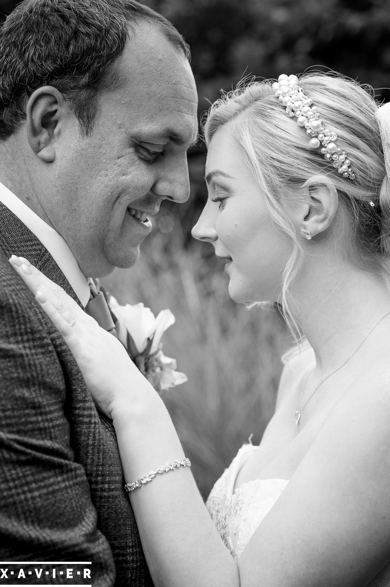 bride and groom look closely at each other