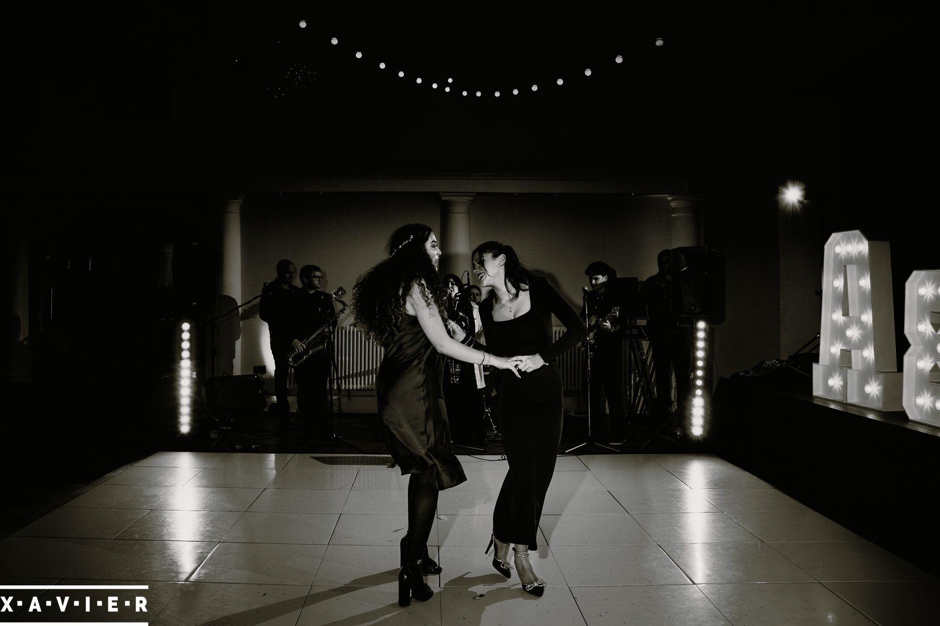 bridesmaids dancing to the wedding band