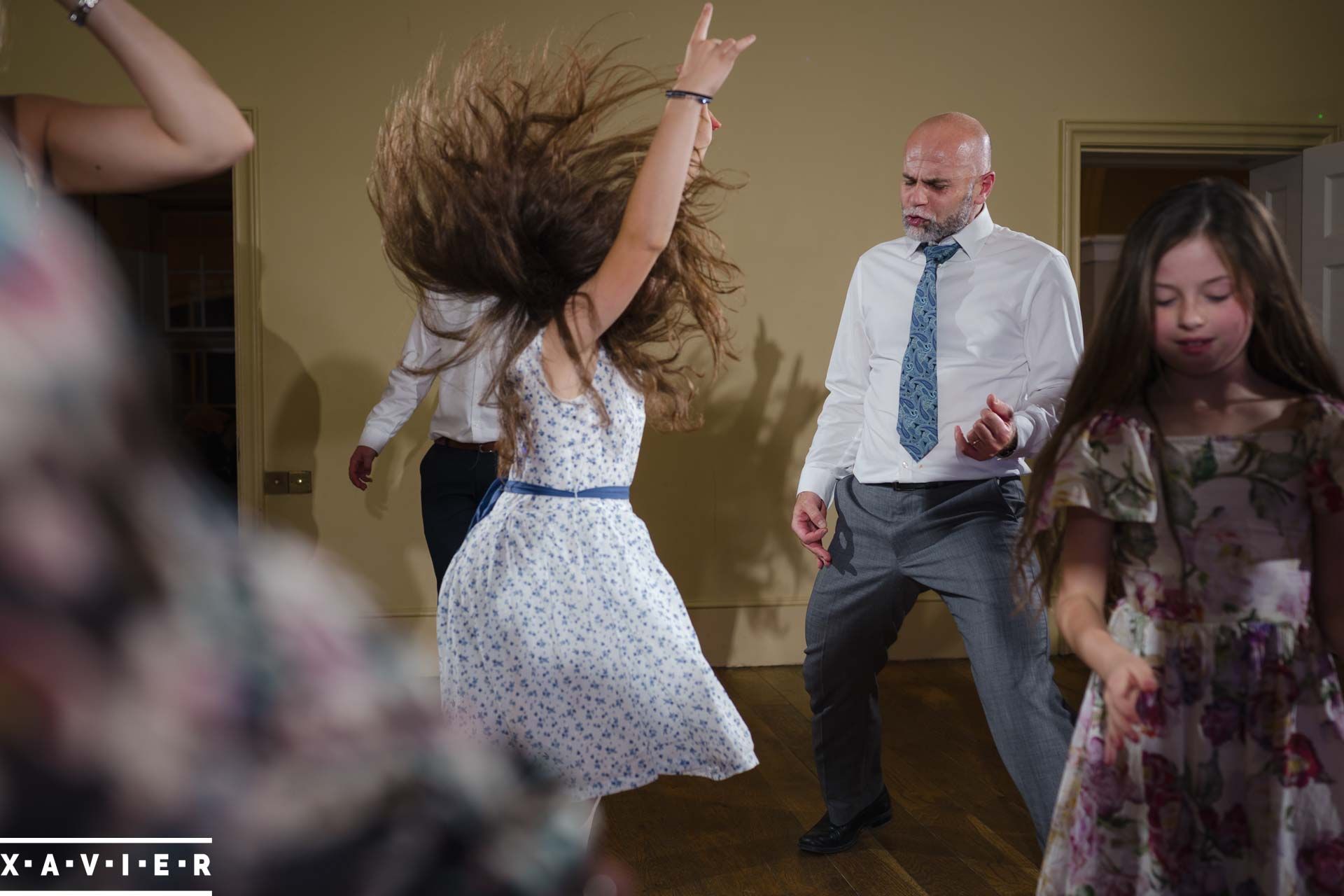 Wedding guests dancing and playing air guitar