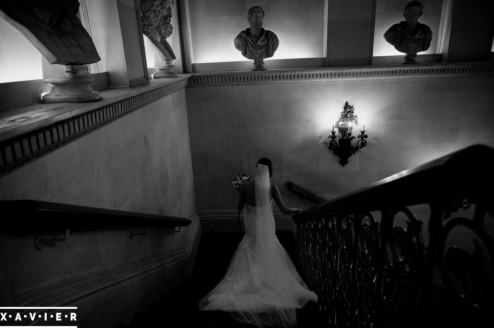 Bride walking down the stairs in her wedding dress