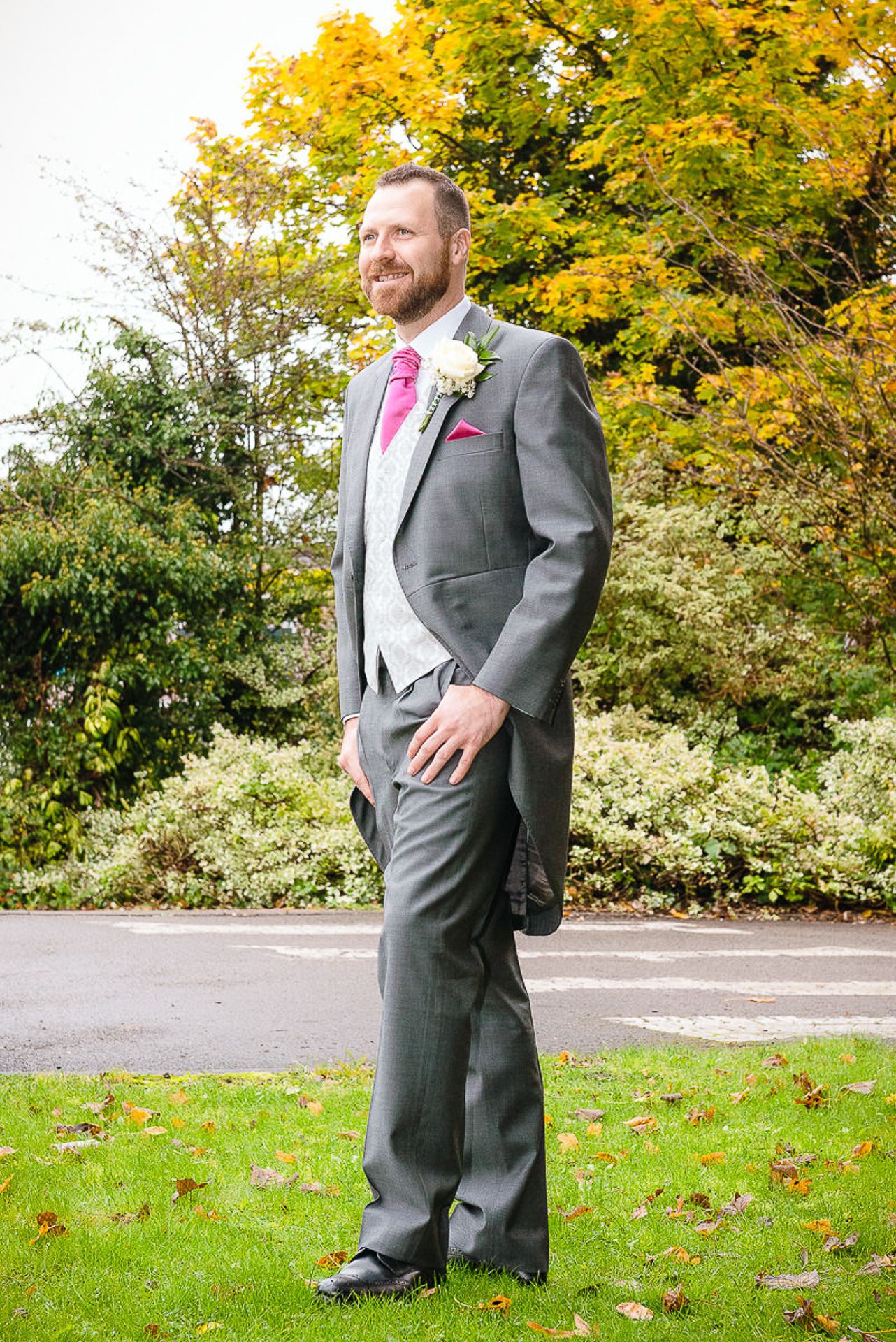 groom standing outside the church
