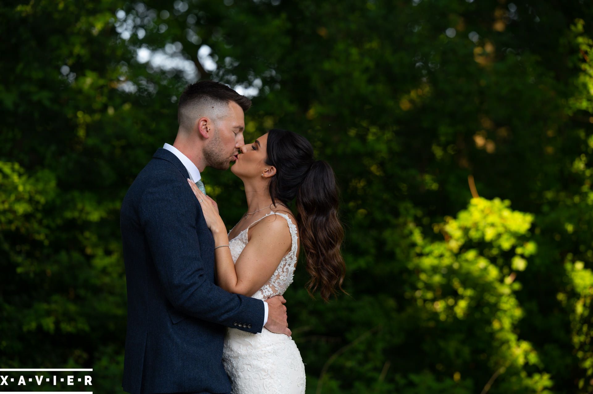 the bride and groom face each other and kiss