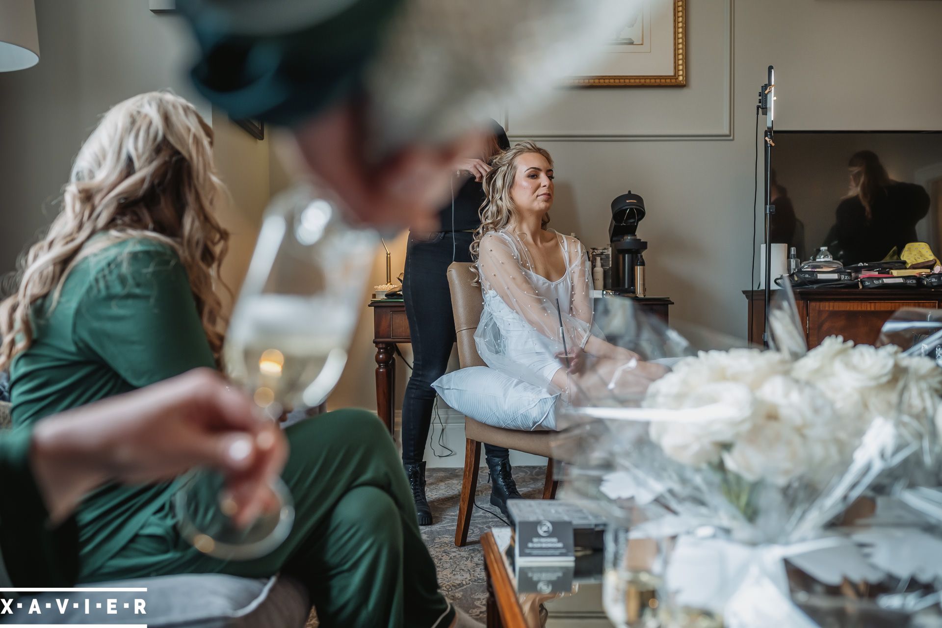 bridesmaid are  getting ready and drinking champagne