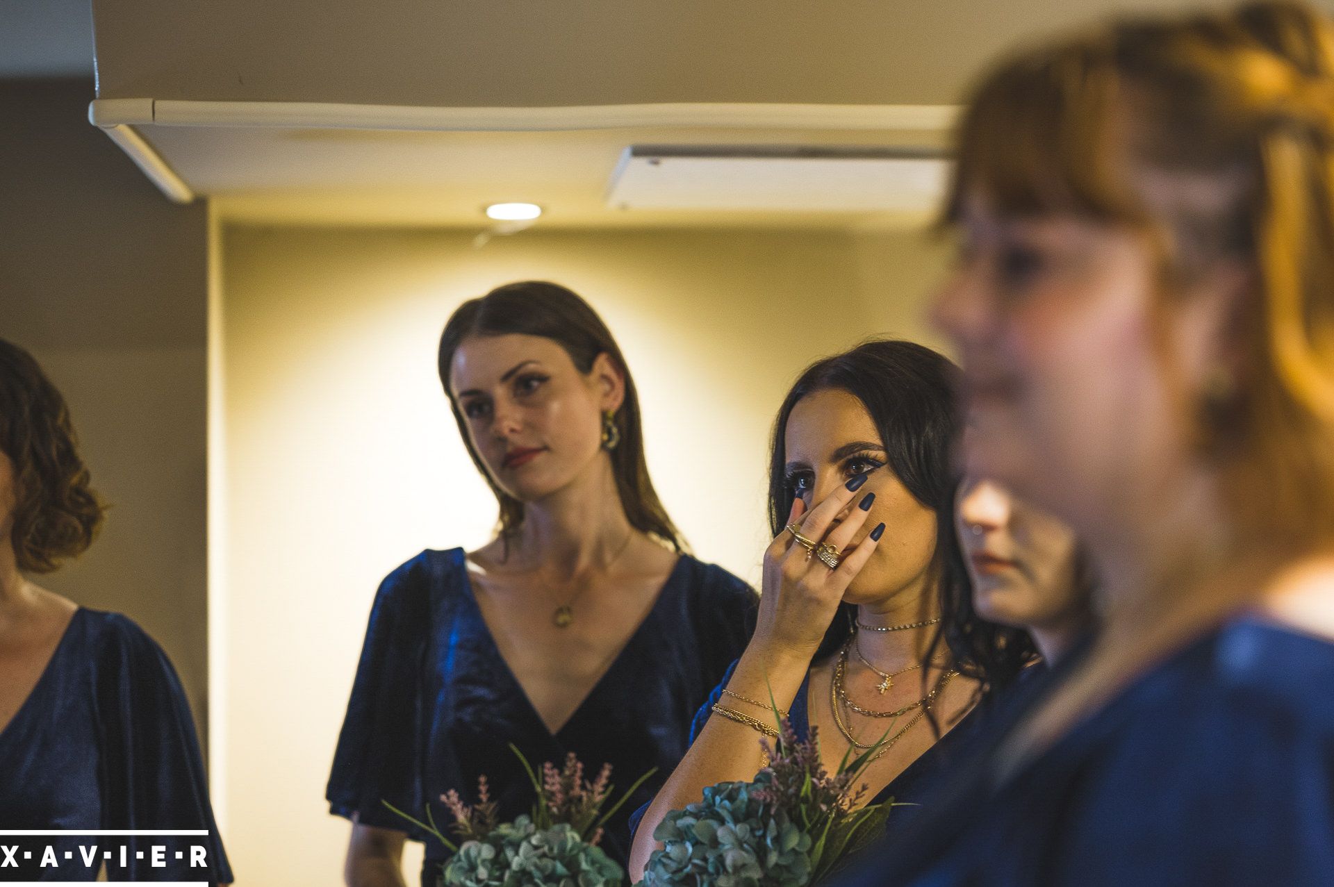 bridesmaids are emotional at the brides reveal