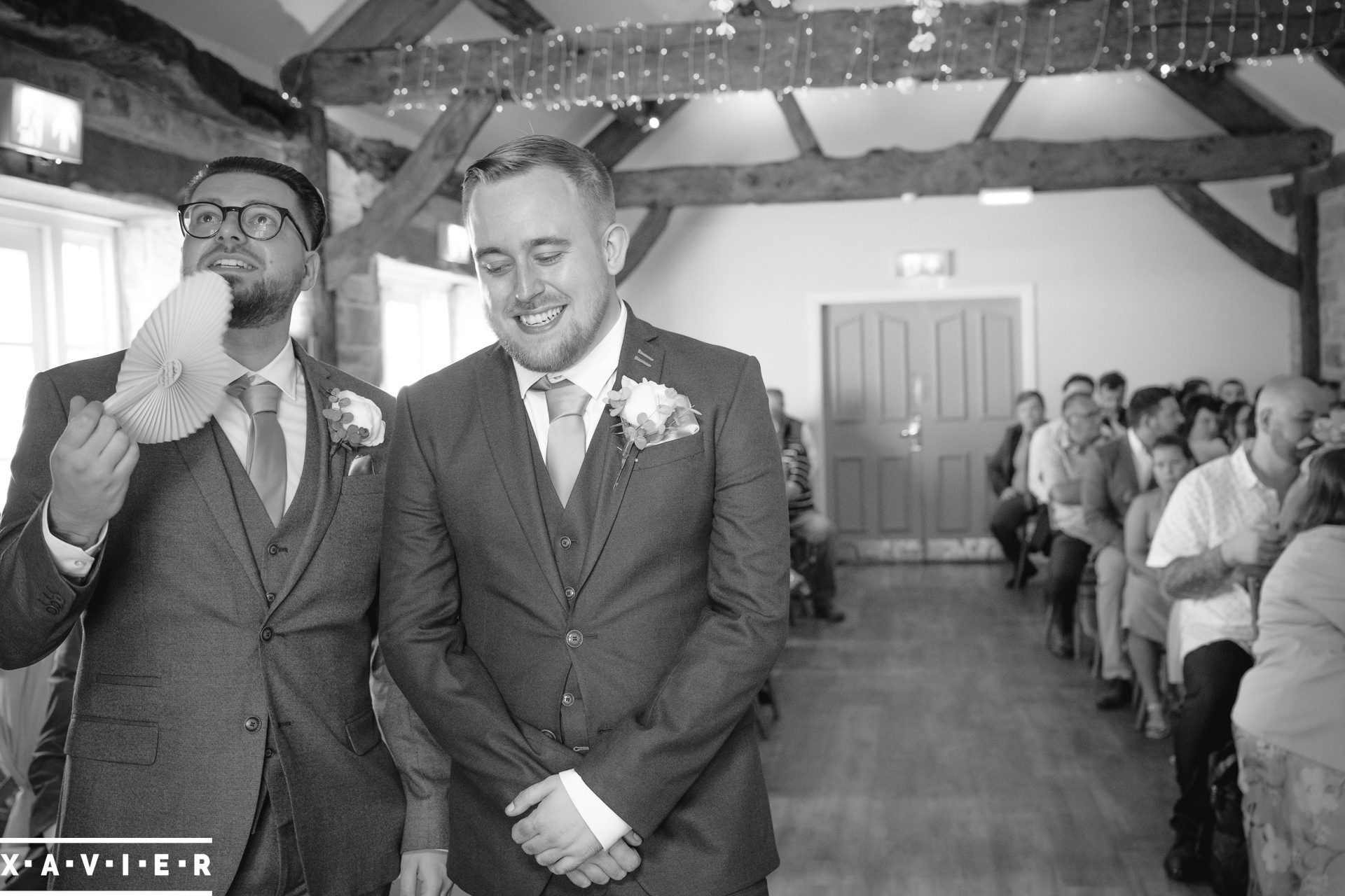 groom and groomsmen stand together waiting for the brides entrance