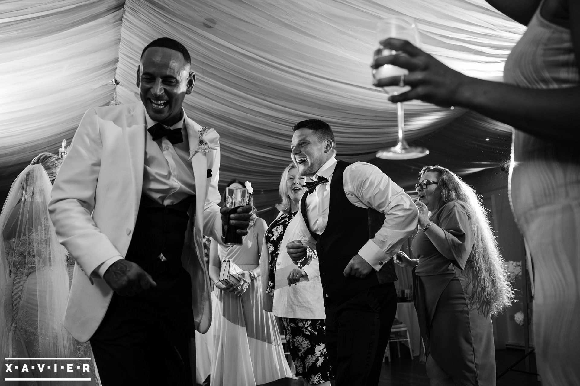 Groom dancing with the groomsmen