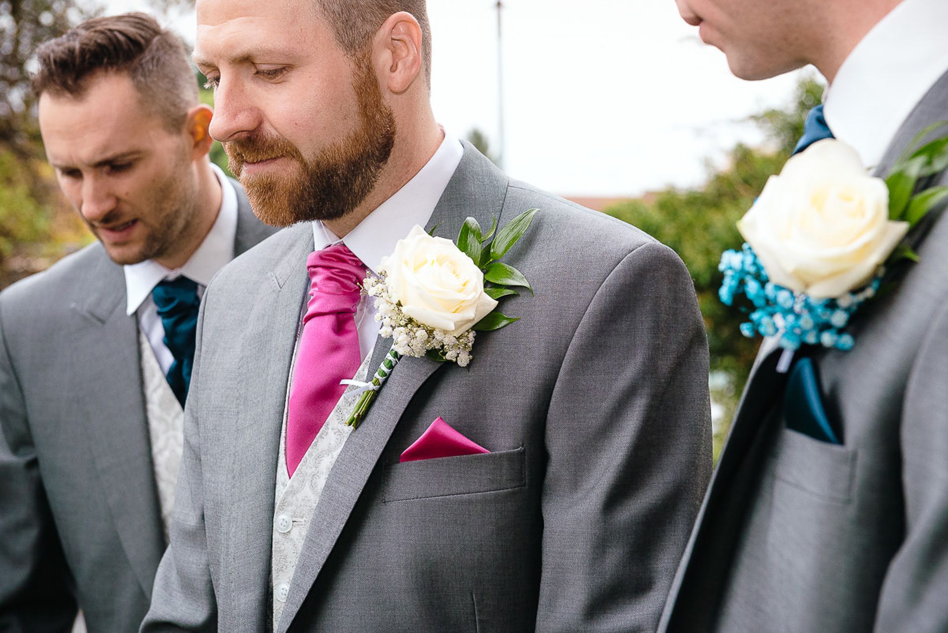 buttonhole flowers on groom and groomsmen