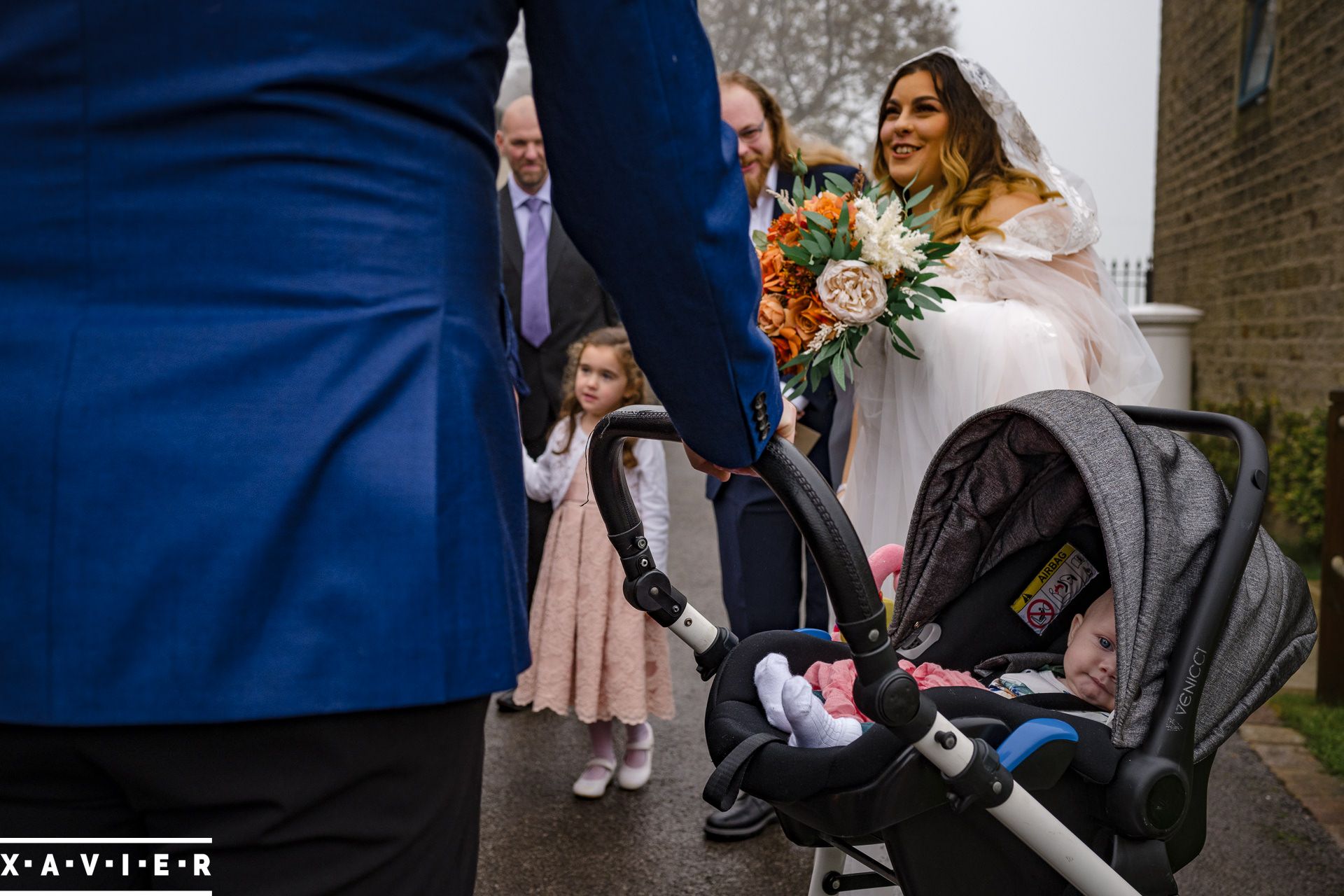 baby wakes as the bride appears