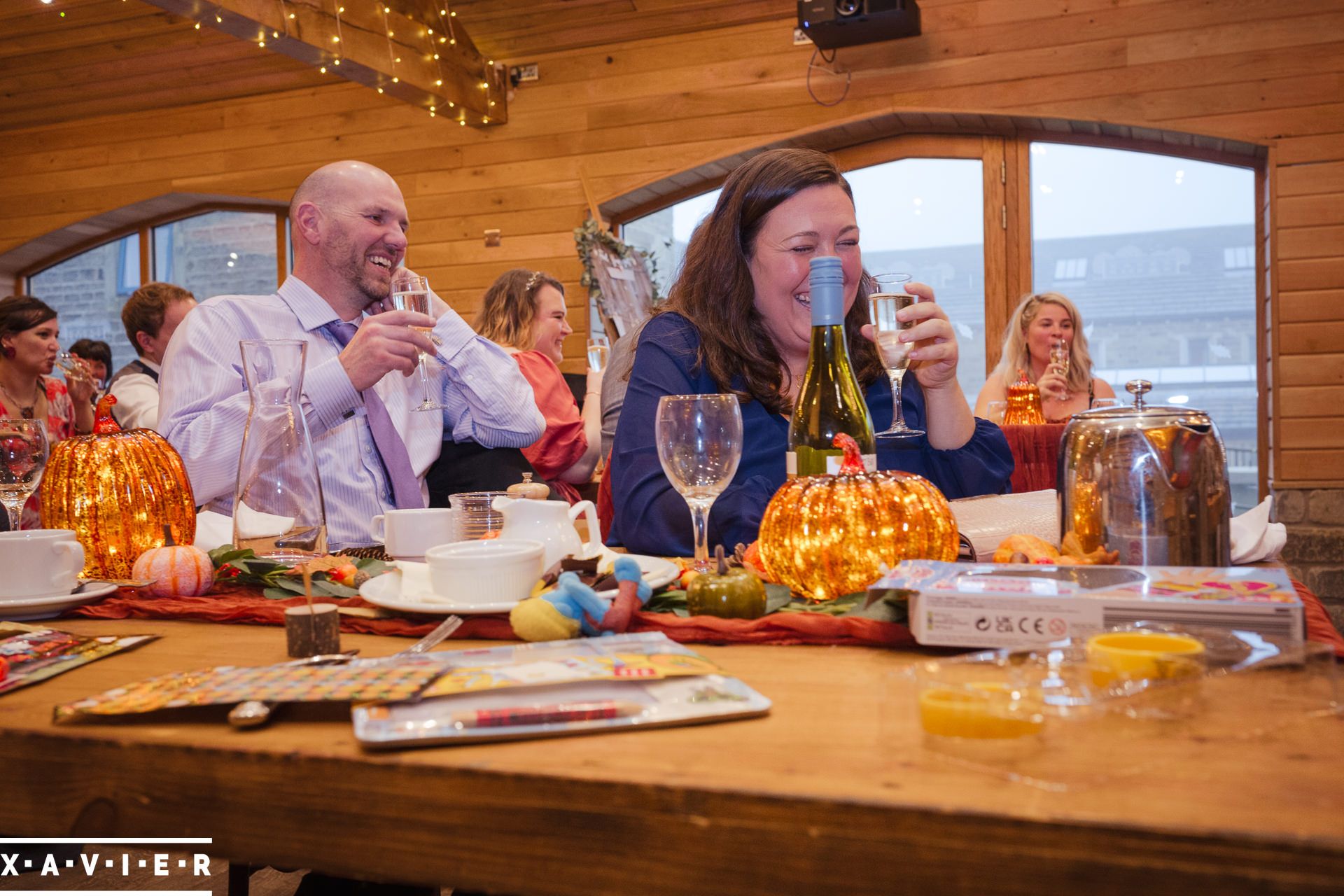 Guests laughing during the wedding speeches