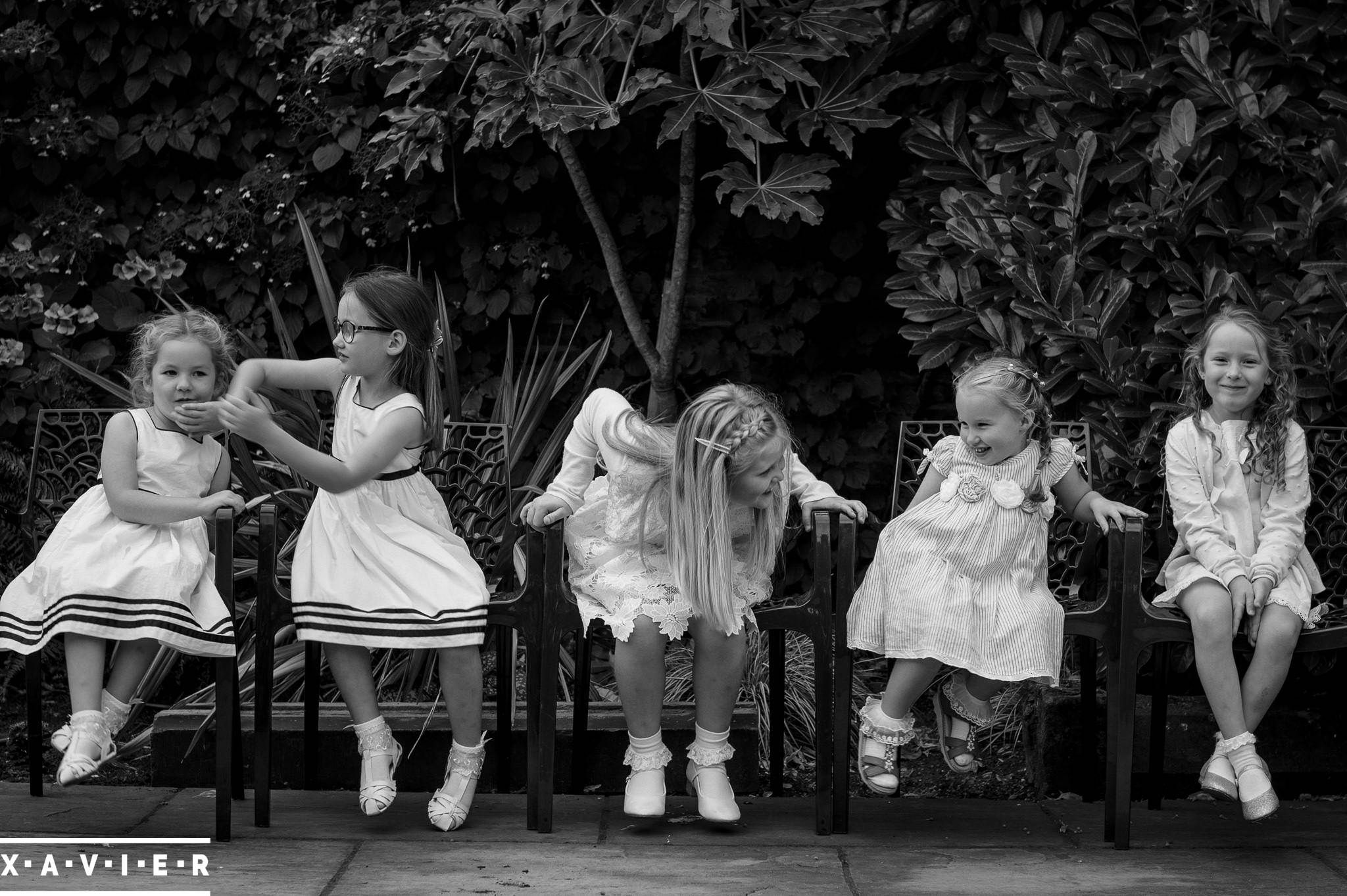 wedding guests sitting in a line and chatting