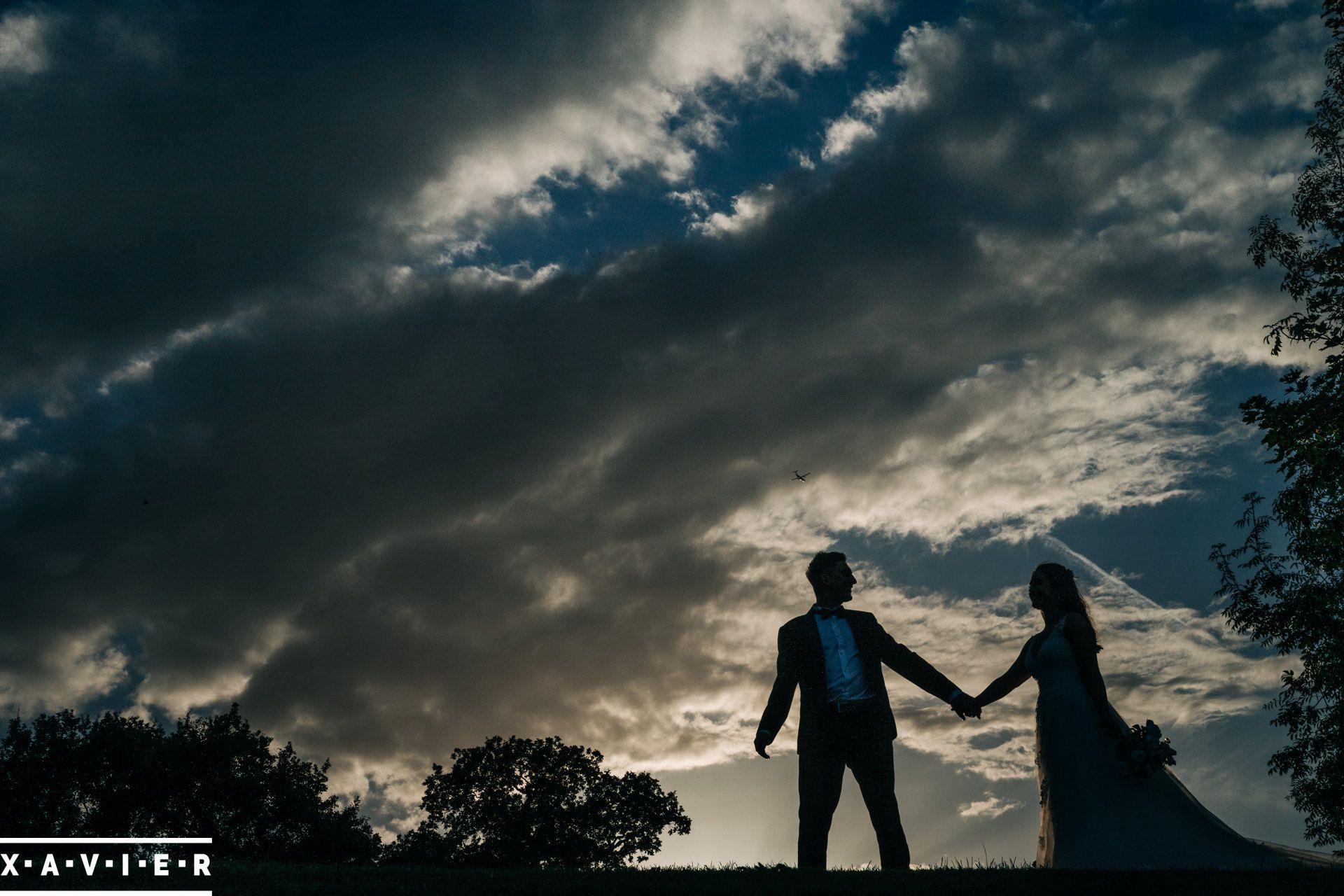 shilouette of brid and groom walking