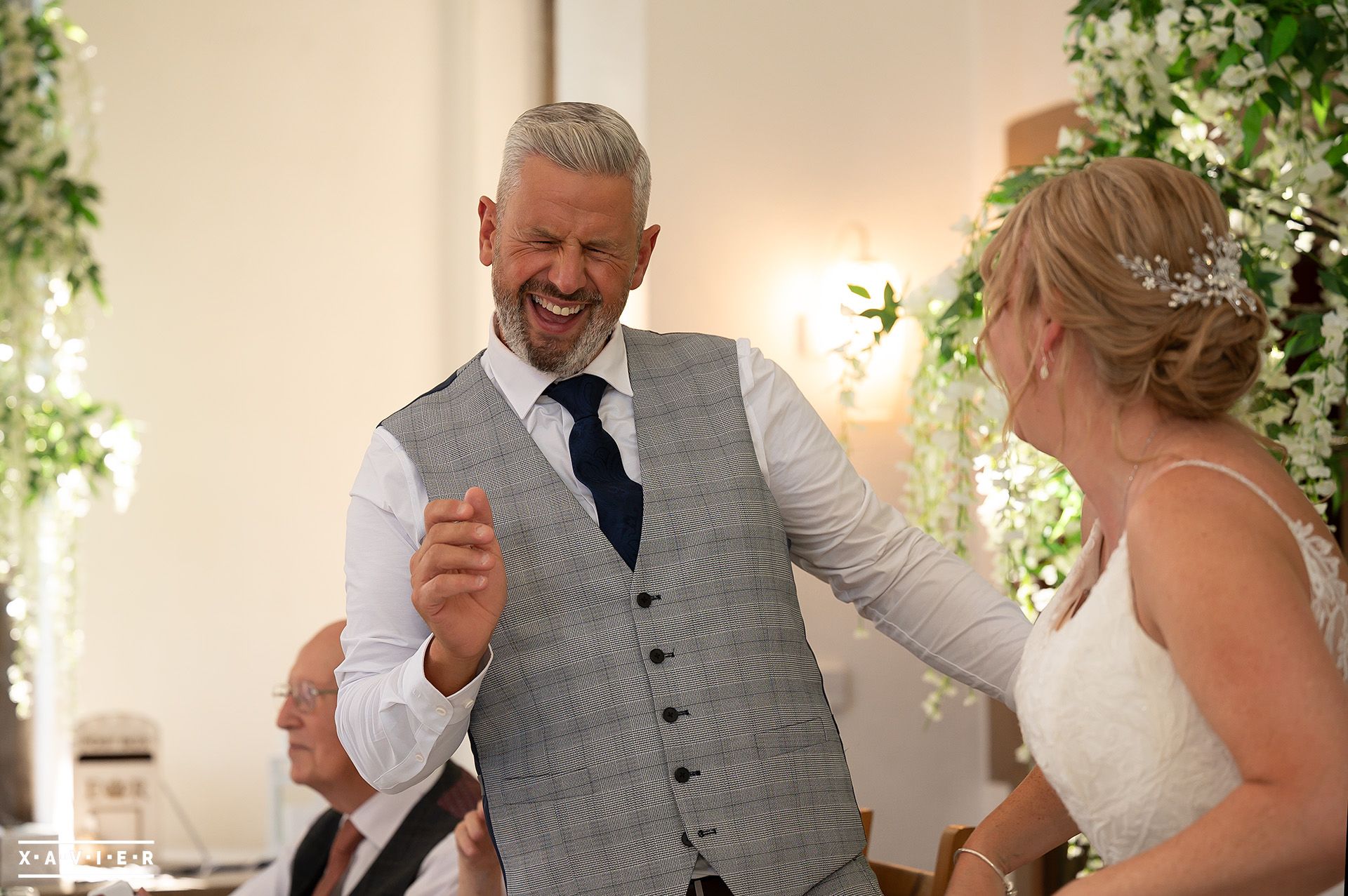 Groom laughs during the speecch