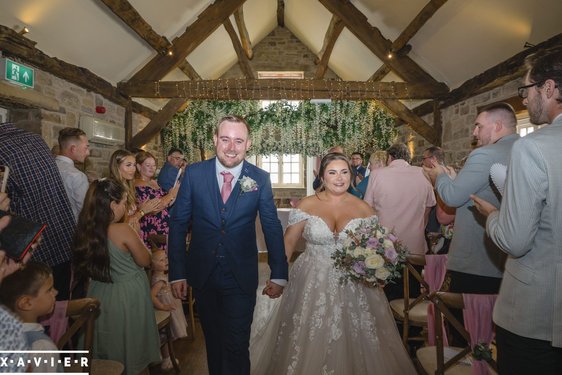 bride and groom walking down the aisle