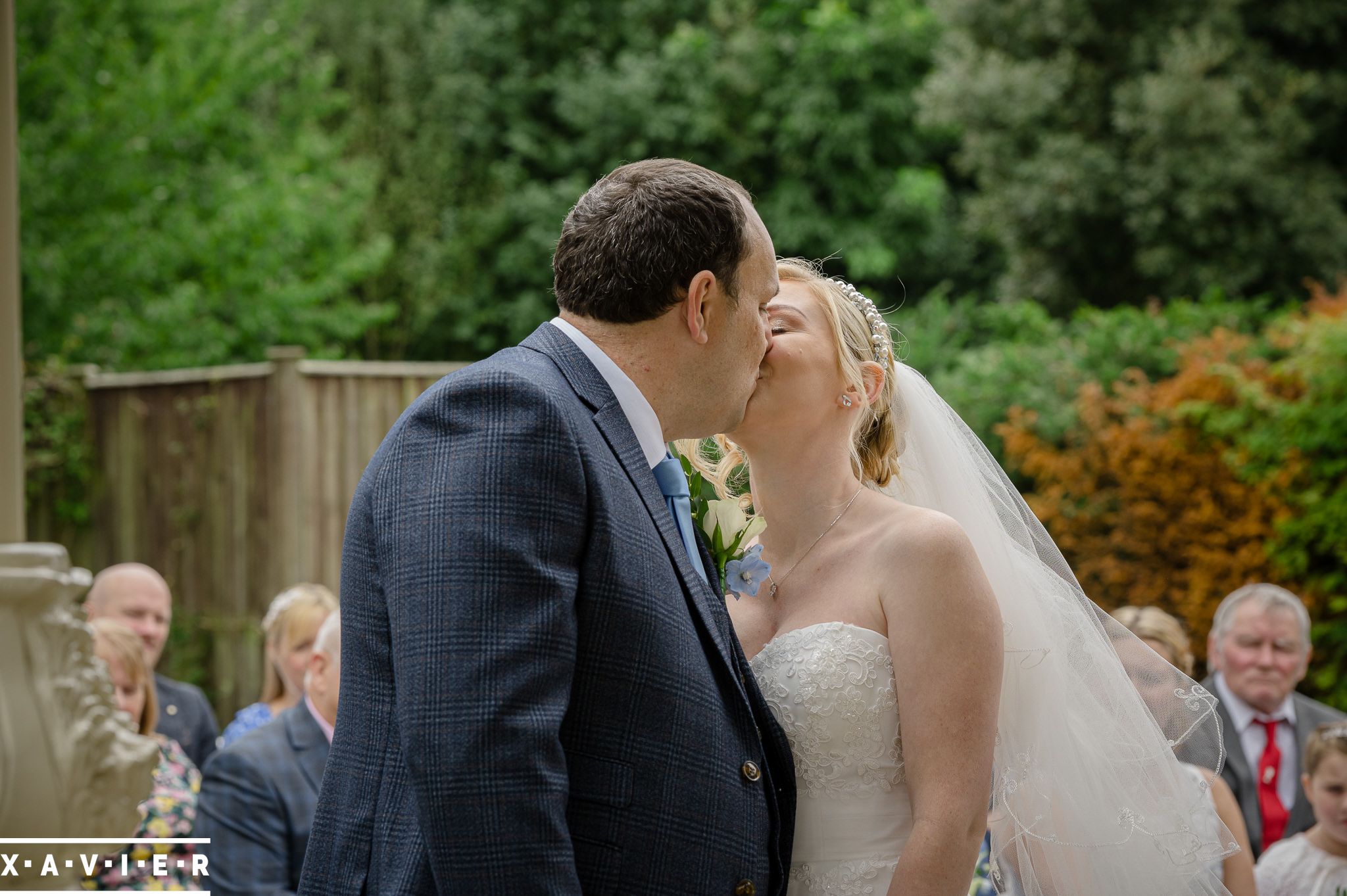 bride and groom have first kiss