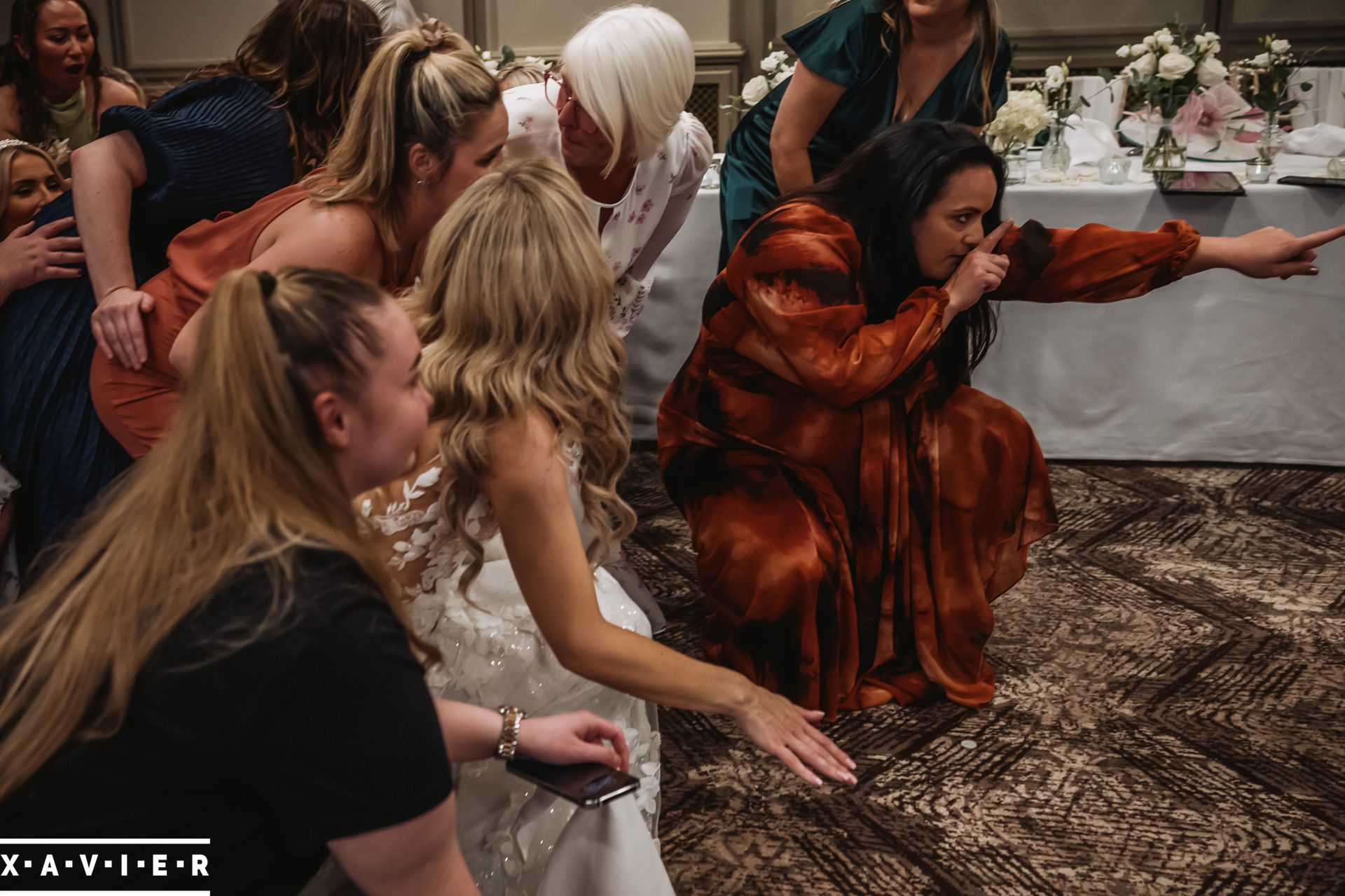 bride and bridesmaids kneeling down