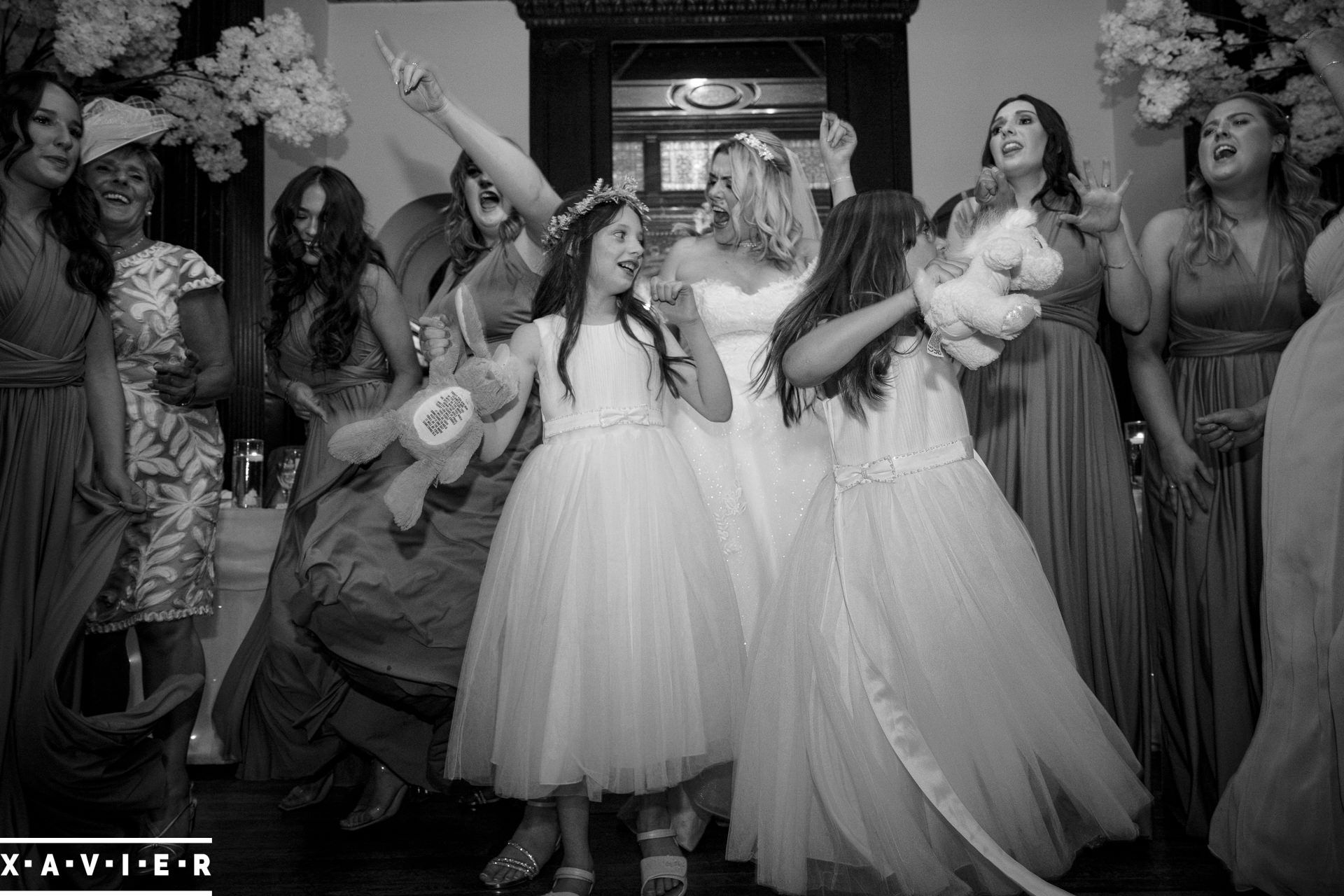 Bride and bridesmaids dancing