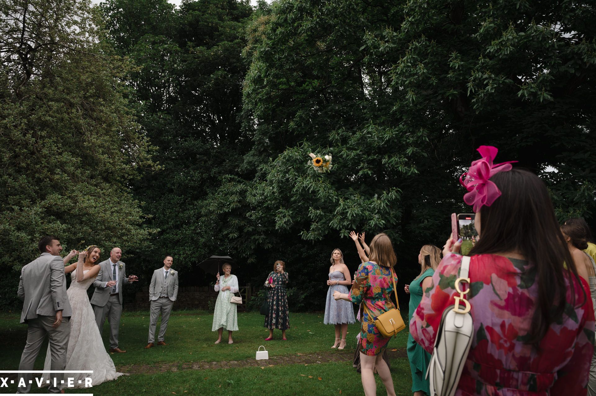 the brides bouquest is thrown in the air